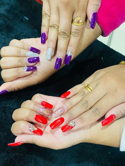 A side-by-side look at two different glamorous sets, one in purple and silver and the other in red and gold, both featuring glitter and rhinestone embellishments.