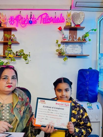 Celebrating another student's success as she receives her certificate of completion. Each certificate marks a significant step in her journey to mastering mental math.