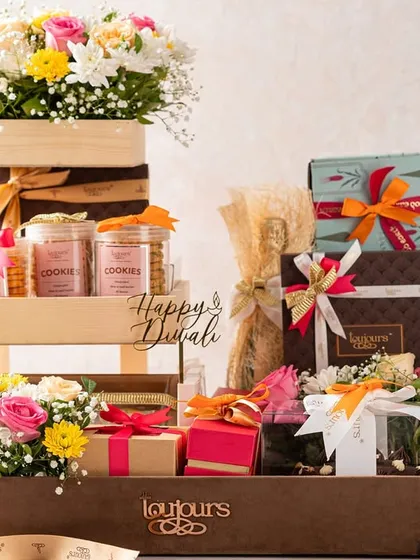 A grand, two-tiered wooden hamper overflowing with gift boxes, cookie jars, and fresh flowers. This is one of my most luxurious offerings, designed for making a lasting impression with corporate clients or loved ones.