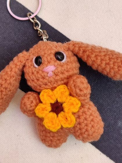 Adorable bunny keychains holding little red hearts, made for Valentine's but perfect for any time. I make them in brown, cream, pink, and purple.