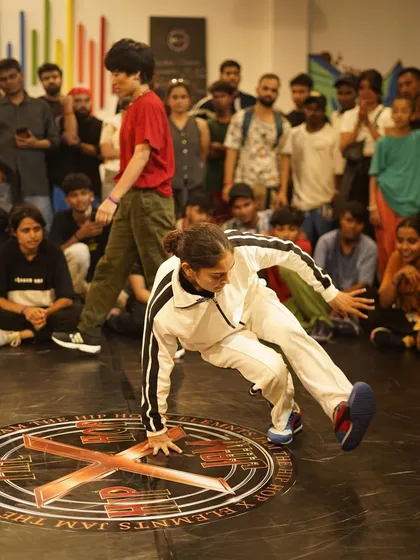 A b-girl owning the floor during a battle at our Hiphop Elements Jam. We make sure to spotlight the incredible talent in the b-girl community with dedicated battles and a supportive atmosphere.