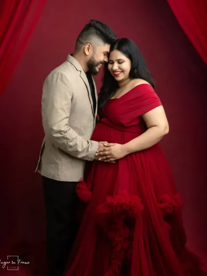 An intimate moment during the elegant gown session. This pose, with the couple close together, focuses on their connection and the shared joy of their pregnancy journey.