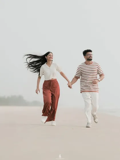 The pure joy of running together on a quiet Mangaluru beach. I focus on capturing these energetic, unposed moments where your personalities shine through, creating memories filled with laughter.