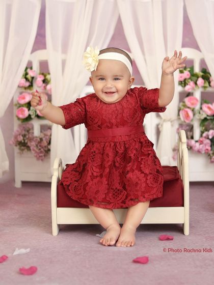 An excited, arms-up pose showing the pure joy of the little girl during her photoshoot.