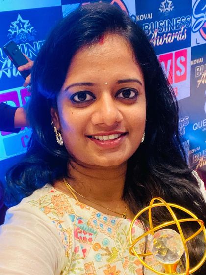 A close-up selfie with the Kovai Business Award. It's a reminder of the journey and the wonderful community that has supported Sukeerthi Plate Decors.