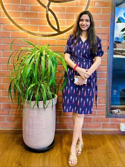 A beautiful happy client glowing in our handloom Ikat wrapped Angrakha. This piece truly blends tradition with timeless style.