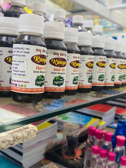 My hair oil bottles displayed in a store, ready for customers to purchase.