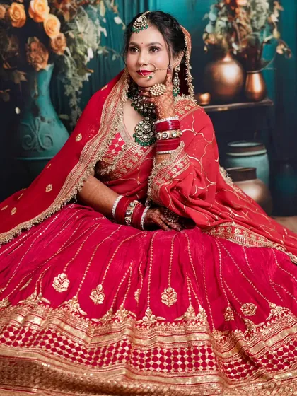 A full-length view of the student's bridal creation, showing how the makeup, jewelry, and outfit come together for a complete, stunning look.