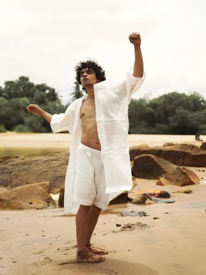 This series showcases a male model interacting with the natural beach environment. From the water to the rocks, each shot captures a different mood, perfect for an editorial story.