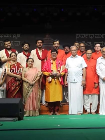 Our group on stage after a devotional program held at Dharmsthala. It is an honor to share our music at such spiritual gatherings.