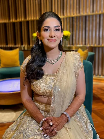 Supriya looking serene and beautiful. Her skin is glowing, and the neutral tones of her makeup complement her intricate outfit perfectly.