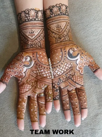 Teamwork makes the dream work! A beautiful Indo-Arabic design with peacock motifs, expertly done by my talented team for a wedding guest.