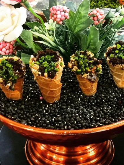 A playful and indulgent treat, these are my Butterscotch Brownie Cones. I fill miniature waffle cones with rich brownie chunks and a creamy butterscotch sauce, creating a fun, handheld dessert that delights guests of all ages.