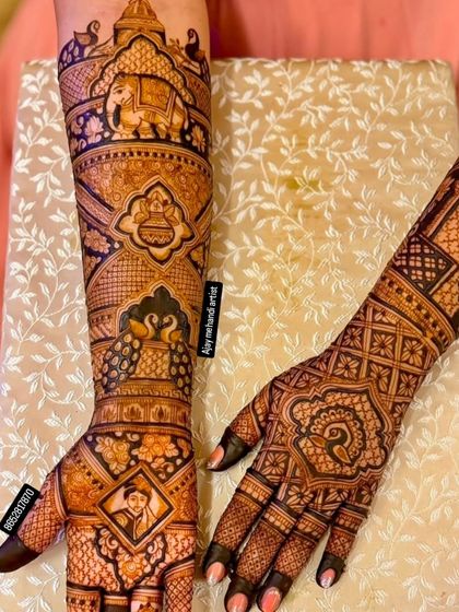 A view of both arms, showing a mix of portrait and traditional design. One arm features intricate patterns while the other has a custom portrait.