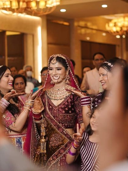 My prettiest bride Ankita, surrounded by her loved ones during her entry. Her smile is so infectious.