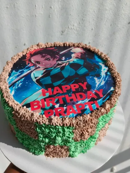 A photo cake for a fan of the anime Demon Slayer, featuring the main character Tanjiro.
