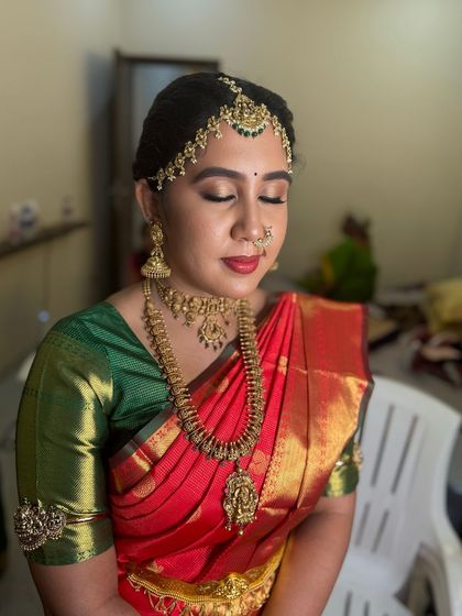 Another angle of Dr. Indhu's makeup, showing the smooth, airbrushed finish of the foundation and the perfectly blended contour that enhances her features.