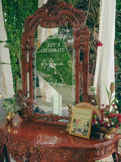 Another perspective of the stunning welcome mirror, showcasing the intricate carving and the personalized message for the couple.