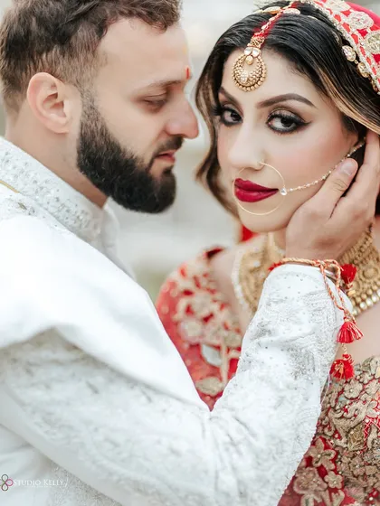 An intimate close-up of a bride and groom in London, showcasing the intricate details of the bridal look and the deep connection between the couple. These are the stolen glances I live to capture.