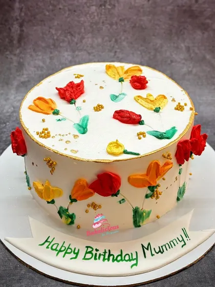 A bright and cheerful floral cake for a mother's birthday. I used a palette knife painting technique with buttercream to create these colourful, abstract flowers.