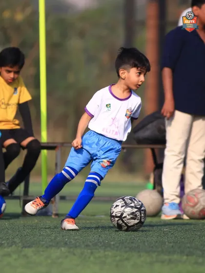 A young athlete showing great form and control, a testament to our grassroots coaching.