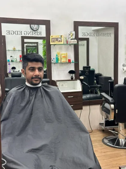 The "after" shot. A clean, classic men's cut that looks sharp and is easy to manage.