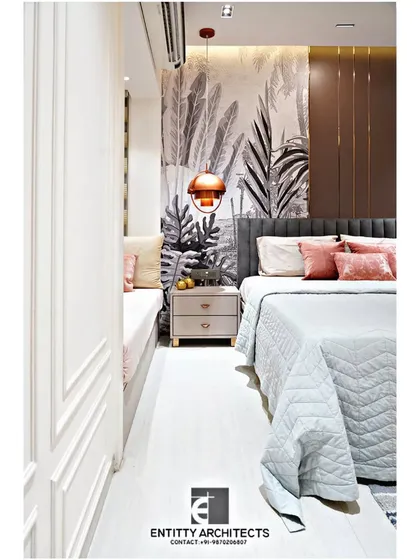 A cozy window seat was integrated into this master bedroom, providing a perfect reading nook. The design features elegant wainscoting on the walls, adding a classic touch to the modern space.