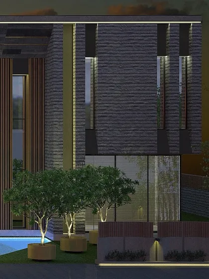 The facade at night reveals a different character, with strategic lighting highlighting the rich textures of the stone and wood. This approach to lighting design adds depth and drama, transforming the home after sunset.