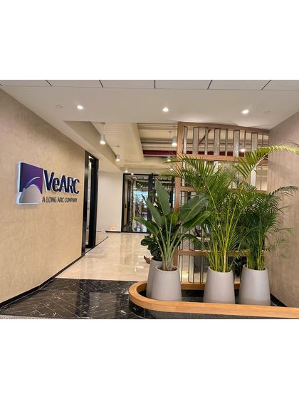 For The Executive Centre (VeArc), we designed a space that complements ambition with calm. The entrance features a curated arrangement of plants that introduces the biophilic theme of the office.