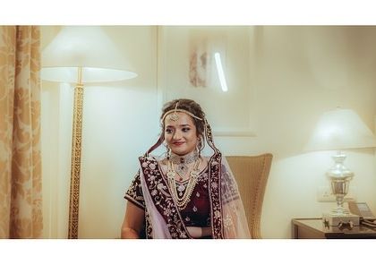 A candid shot of the bride's happy and slightly nervous smile as she gets ready. These are the real emotions I love to capture.