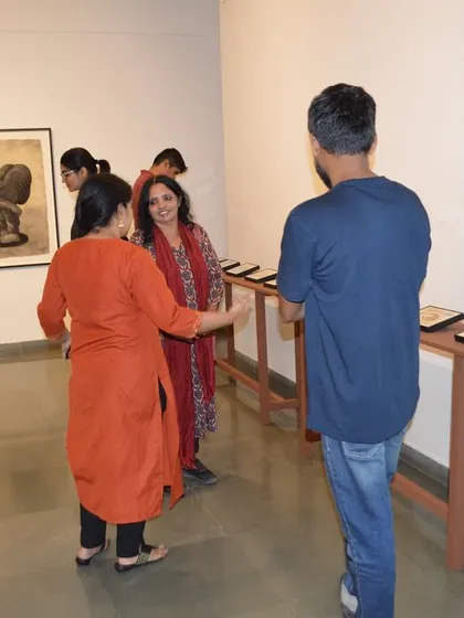Guests interacting at the preview night of Shakuntala Kulkarni's solo show.