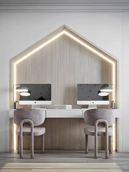 This beautiful, symmetrical study station for two is framed by a house-shaped light feature. The design includes backlit vertical shelves for books and decor, creating an inspiring and elegant workspace.