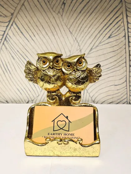 This golden owl-themed cardholder is a perfect, functional accessory for a desk.
