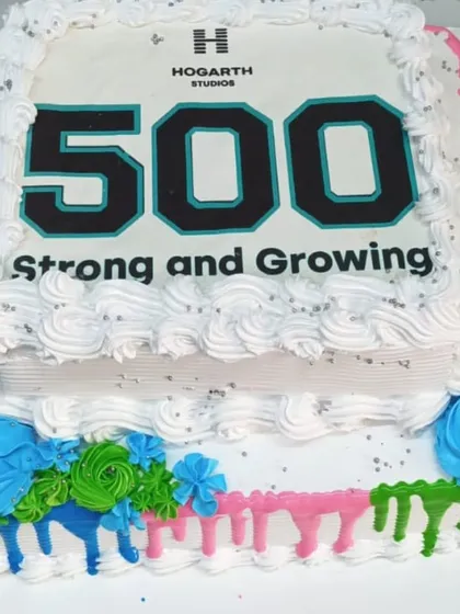 We celebrate your company's achievements with you. This custom two-tier cake was created for Hogarth Studios to mark their milestone of reaching 500 employees, demonstrating our ability to create branded desserts for your special corporate occasions.