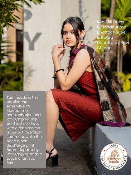 A captivating ensemble featuring a bold red silk dress paired with a hand-block discharge print Bagru dupatta.