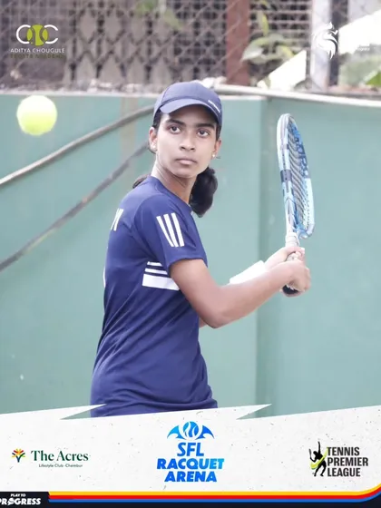 A young female player keeps her eye on the ball as she prepares for a backhand return, demonstrating the focus needed in competitive tennis.
