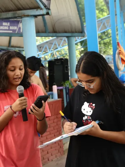 Our dedicated volunteers and staff are crucial to a smooth event. Here, they are managing registrations and announcements at the Future Champions meet.