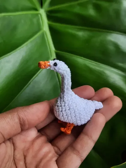 Here's the goose before he acquires his weapon. Even without the knife, he's got a mischievous look in his eye. The pattern for this little guy was my own creation.