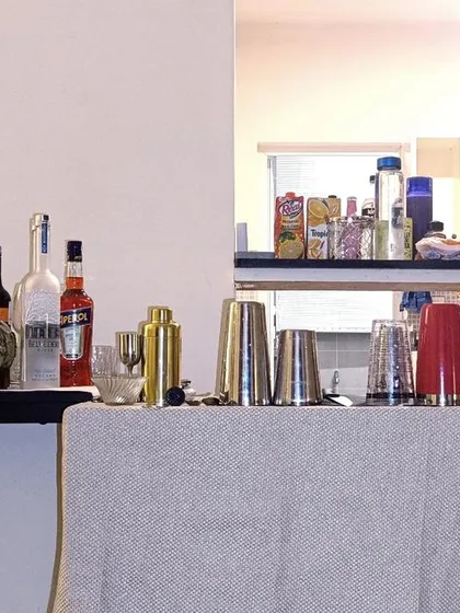 This is a compact bar setup perfect for house parties or smaller indoor events. I can fit a professional bar experience right on your dining table or in a corner of your living room.