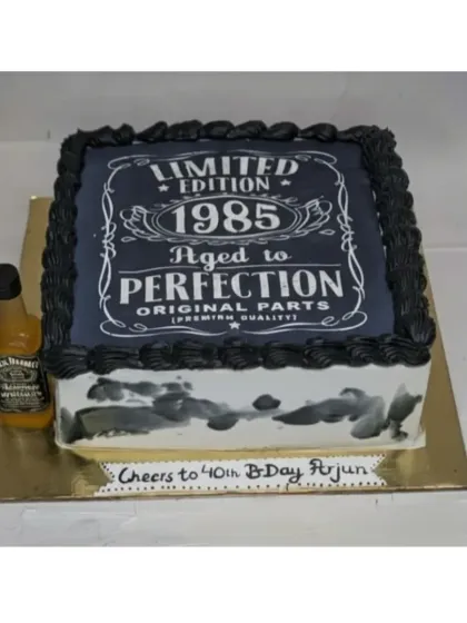 "Aged to Perfection." A Jack Daniels-themed sheet cake for a 40th birthday. This choco-vanilla cake is a great choice for a milestone celebration for him.