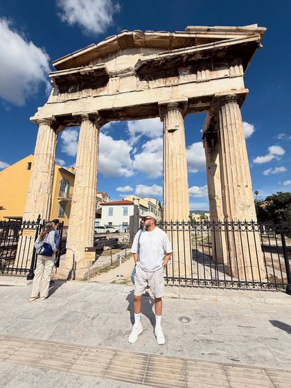 In Athens, standing before ancient ruins. My all-white and grey outfit is a nod to the classical surroundings, keeping it light and comfortable for a day of sightseeing.