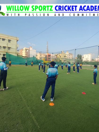Players spread out for a catching drill. We teach them to stay low, anticipate the ball, and move quickly to get into position.