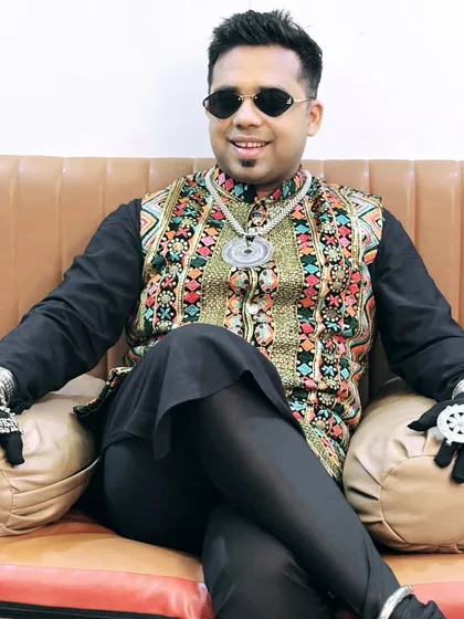 Relaxing backstage in my Day 4 Navratri attire. This Rajasthani-inspired look featured a heavily embroidered jacket and unique silver accessories.