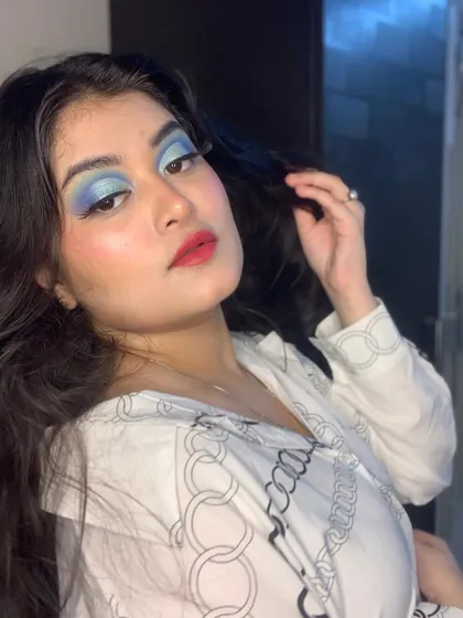 Another angle of the bold blue eye makeup, showing how it opens up the eyes.