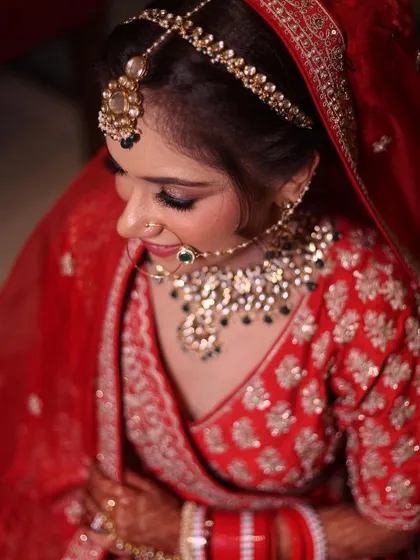 A beautiful, soft-focus shot of the bride, highlighting her delicate features and the stunning jewellery she chose.
