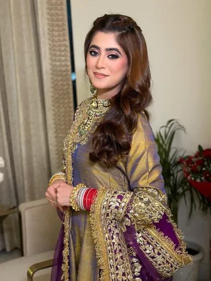Resplendent in Indian couture for her pre-wedding festivities. This look features a dramatic smoky eye, balanced with a soft nude lip and glowing skin.