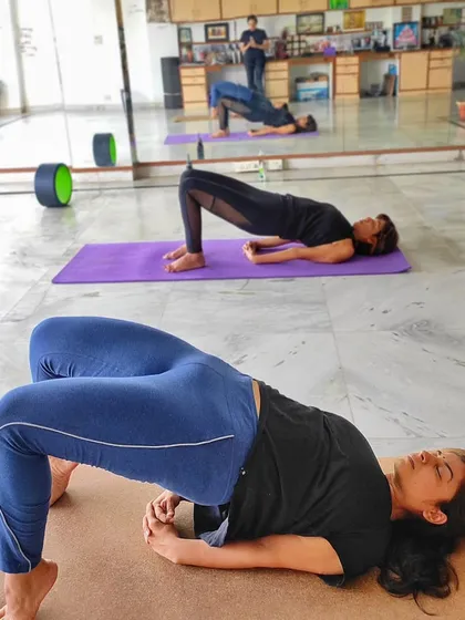 Students in Setu Bandhasana (Bridge Pose) during a class at my Delhi center. This pose is fantastic for strengthening the back and opening the chest, and we explore different variations to suit everyone.