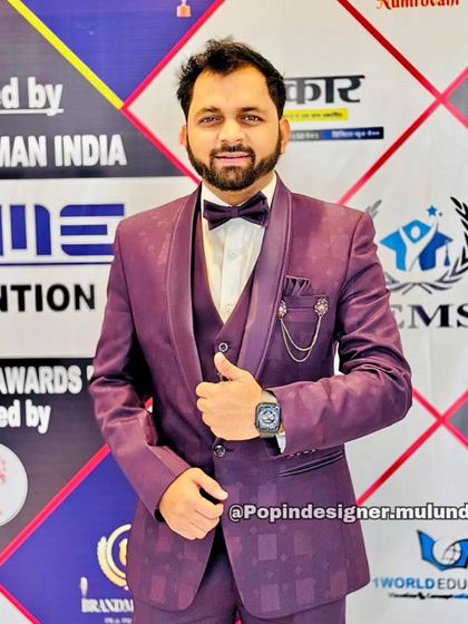 Here's another one of my happy clients in a purple patterned three-piece suit. The subtle texture and chain accessory make this a standout formal look.