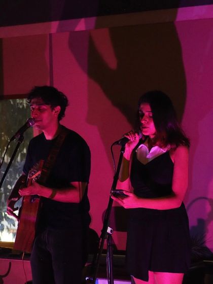 Performing with a fellow musician. Duo setups like this add a beautiful conversational layer to the music.