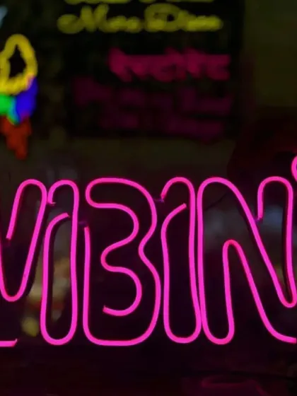 A fun 'VIBIN' neon sign in bright pink, perfect for a Sangeet, cocktail party, or a cool photo booth.
